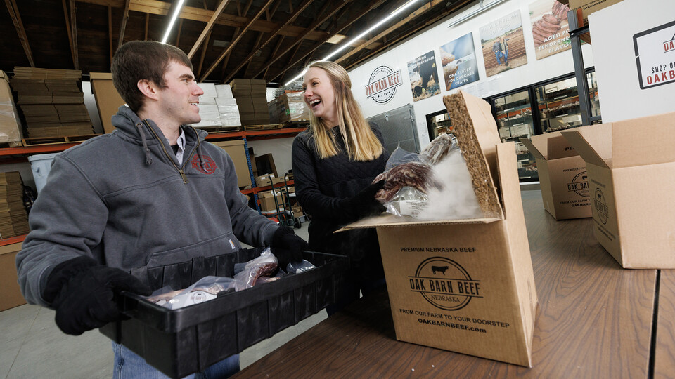 Engler grads pack boxes for customers in business they started