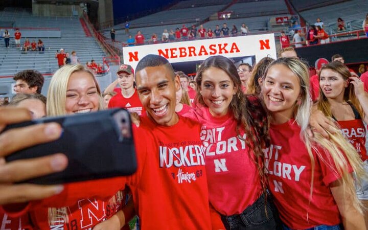 Students take selfie at the end of the Tunnel in Memorial Stadium.